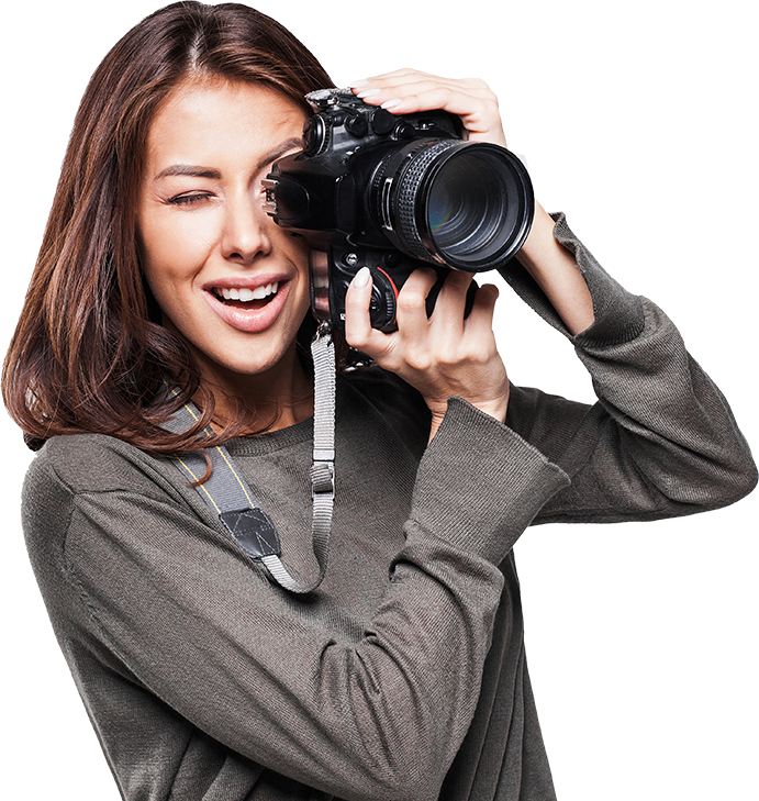Young woman photographer taking pictures using dslr camera